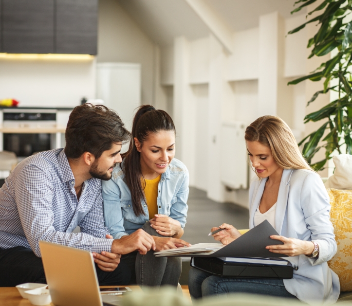 3 people looking over documents